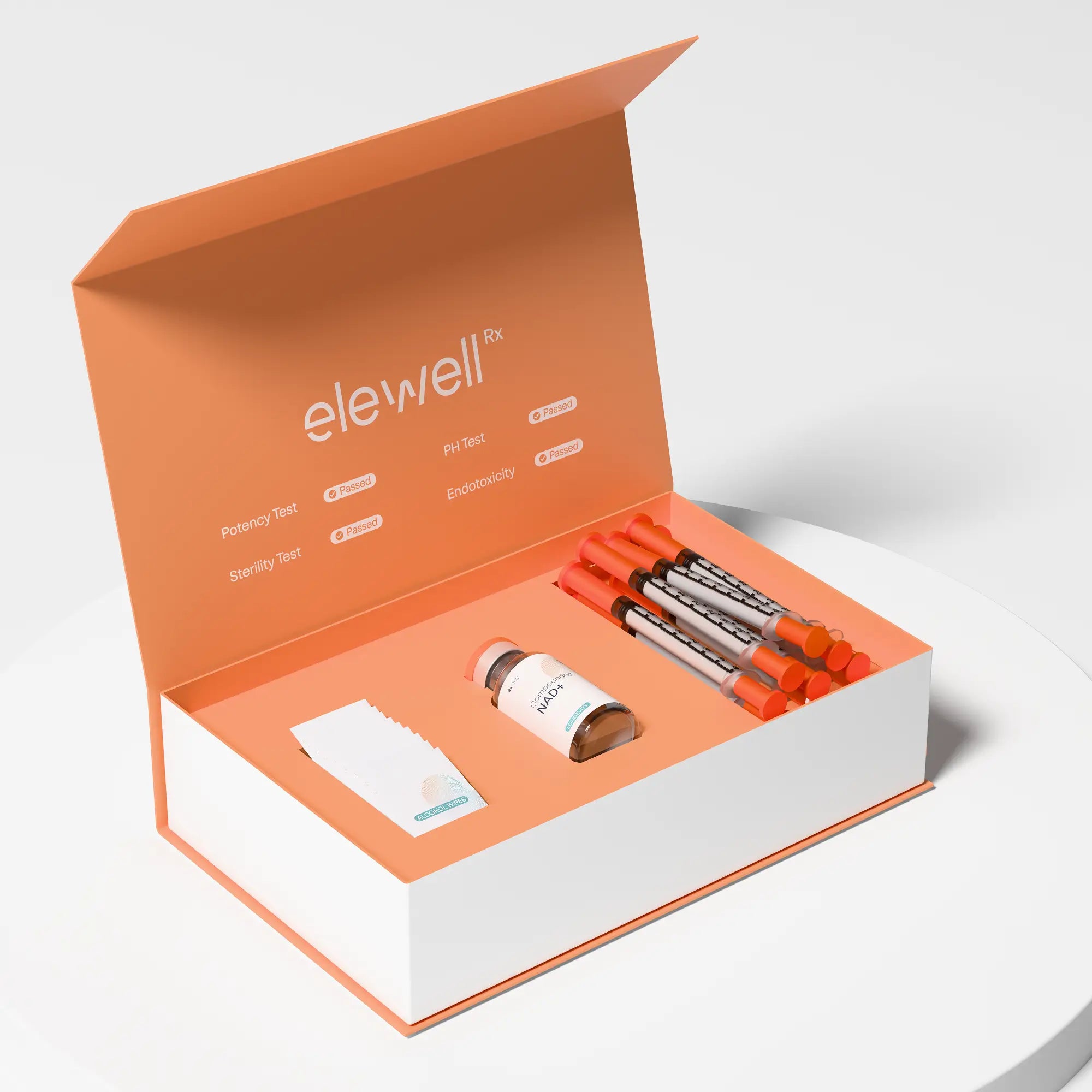 Open orange and white box containing medical supplies with 'elewell' branding.